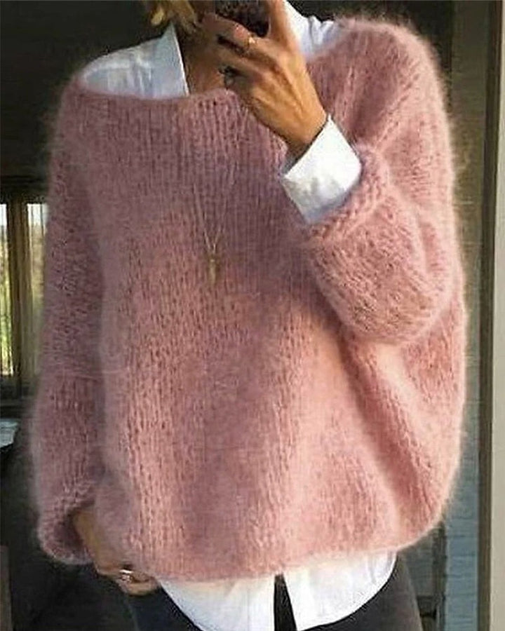 Pink fluffy knit oversized sweater worn over white shirt, person view | Grace Aura