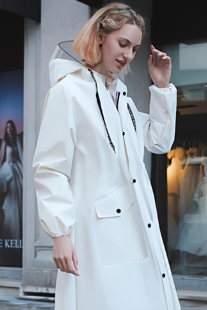 White long waterproof raincoat with hood and drawstring waist