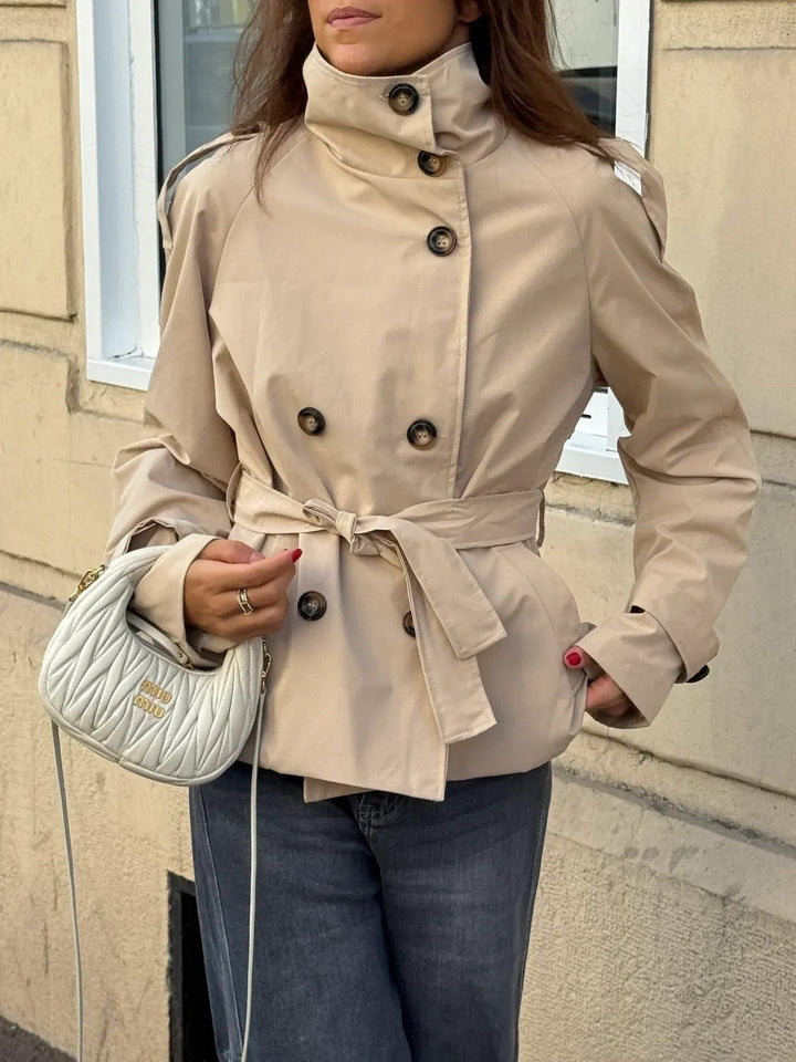 Beige short belted trench coat with high collar