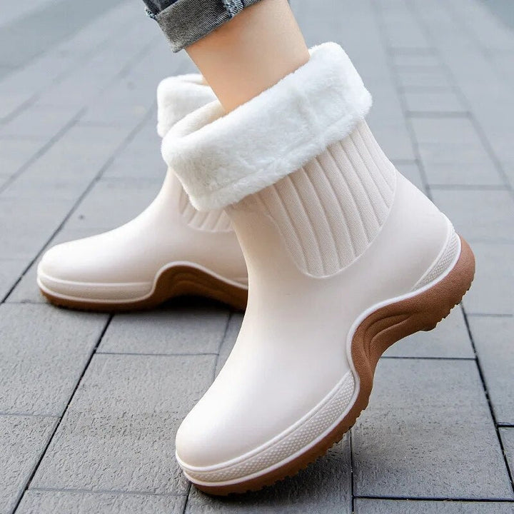 Faux fur lined wellies in cream, worn on the street