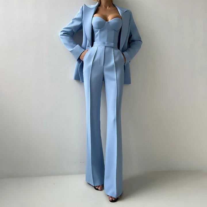 Three-piece trouser suit with bustier top, flared trousers and blazer in light blue, worn, front view