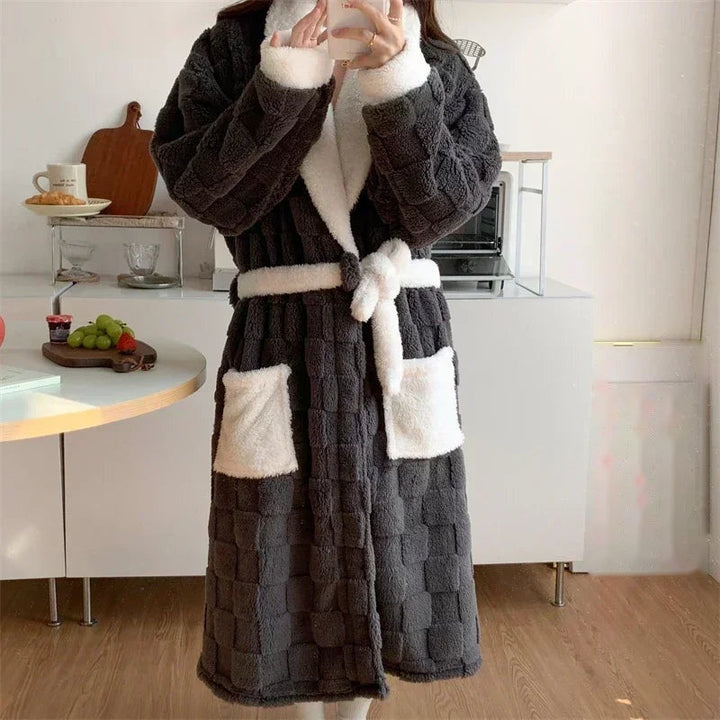 Long charcoal dressing gown with cream teddy collar, cuffs and pockets, front view in a kitchen