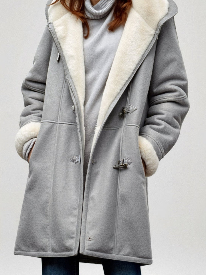 Grey duffle-style winter coat with teddy-lined hood, front view