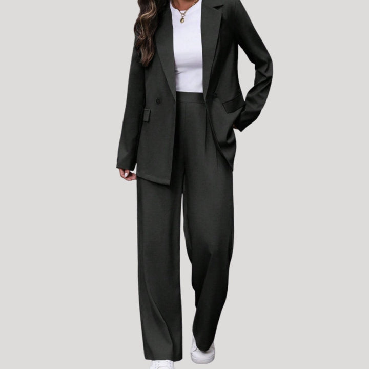Two-piece suit with double-breasted blazer and wide-leg trousers in black, worn, front view