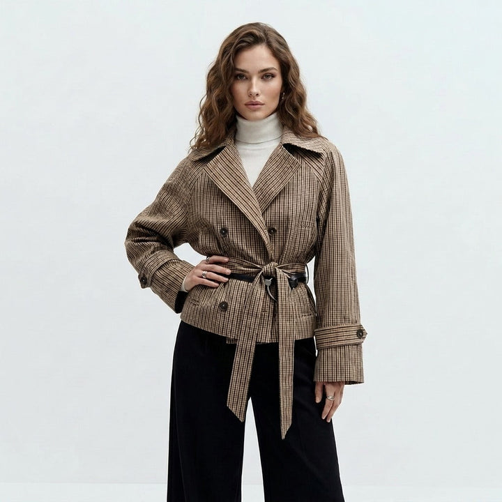Short trench coat with tie belt in brown check, worn, front view