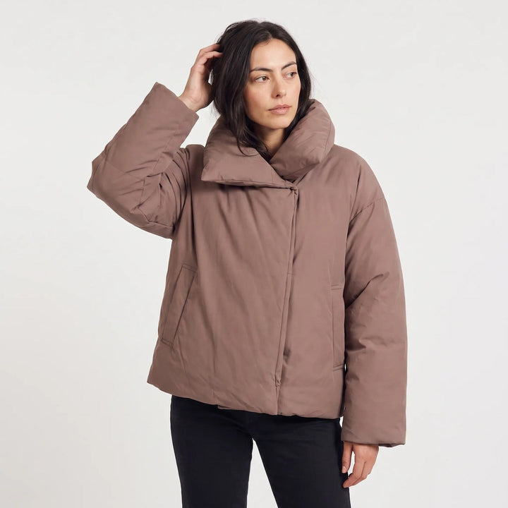 Cropped oversized puffer jacket with wide collar in chestnut brown, worn, front view