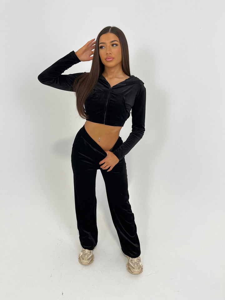 Black velour tracksuit with cropped zip hoodie and straight-leg trousers, front view