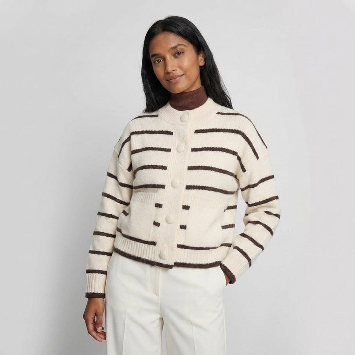 Knitted cardigan with patch pockets in cream with brown stripes, worn, front view