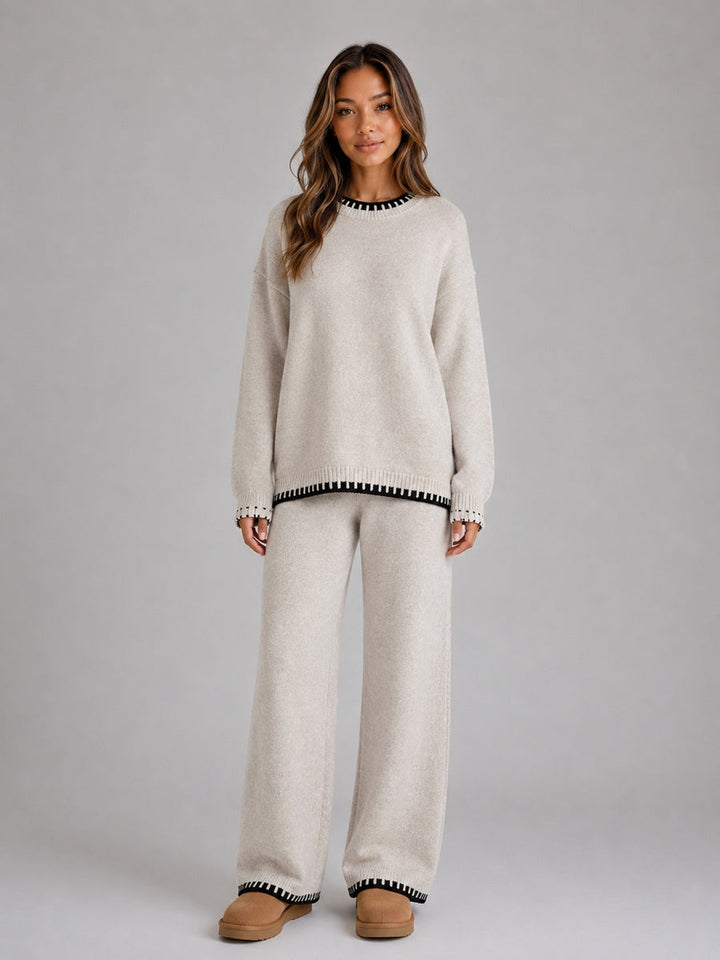 Beige knitted co-ord set with black contrast trim, front view