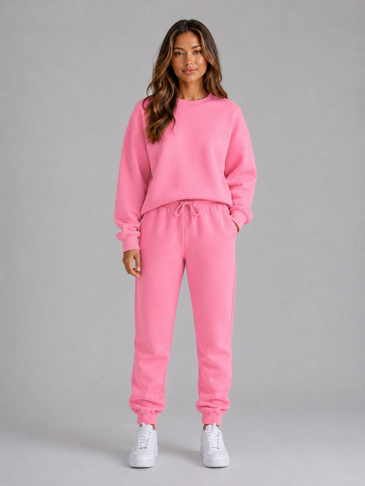 Pink crew neck sweatshirt and cuffed joggers, front view