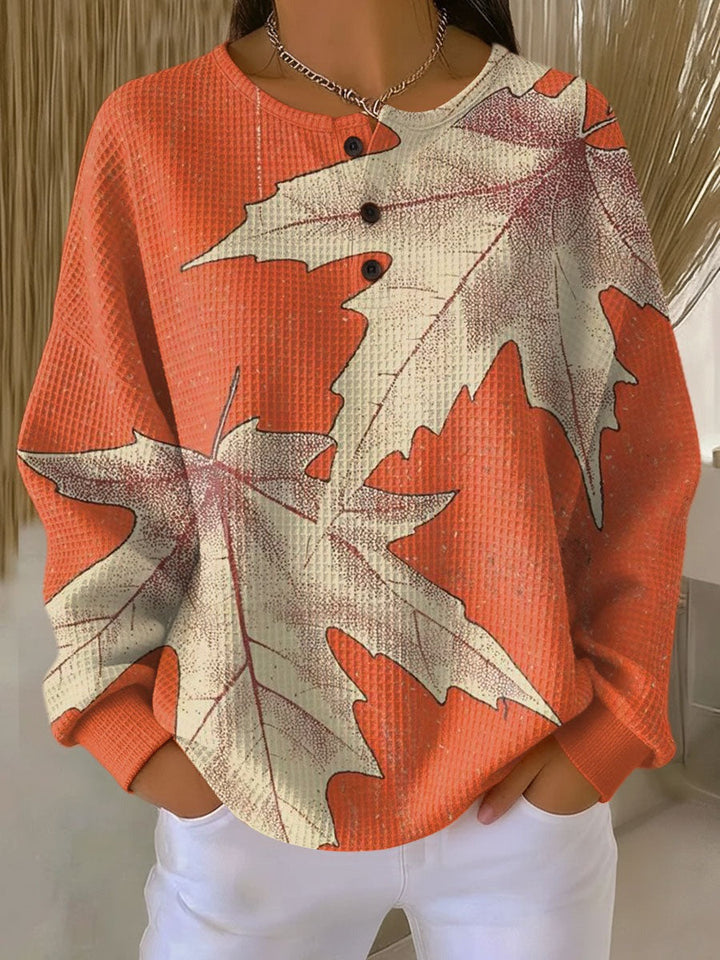 Waffle knit jumper with leaf print in orange, worn