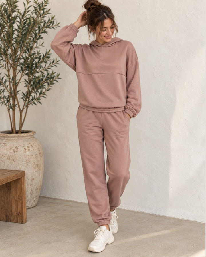 Woman in a dusty rose hoodie and jogger set