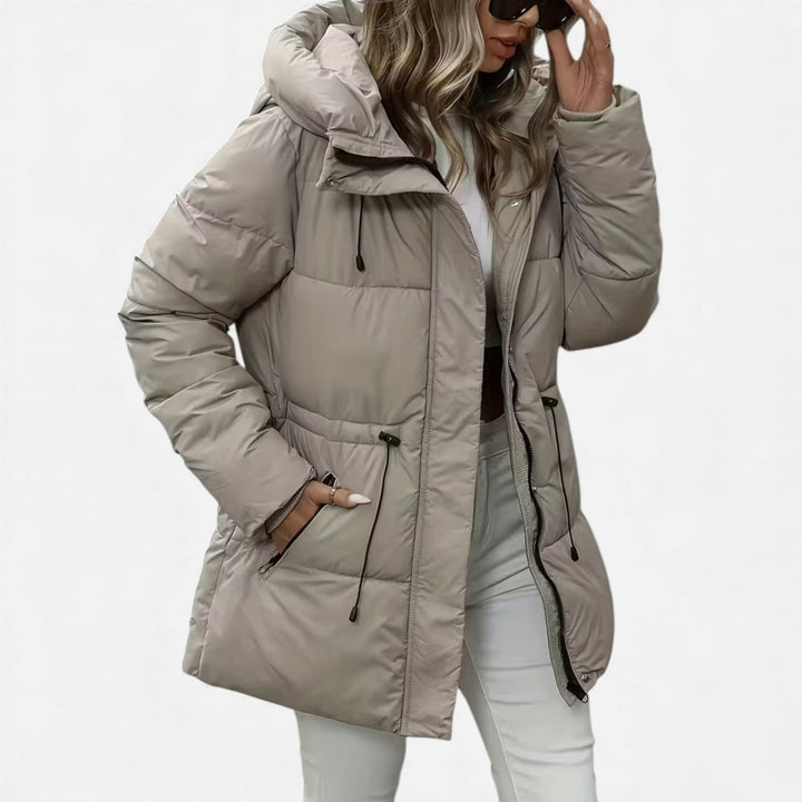 Hooded puffer coat with drawstring waist in beige, worn, front view