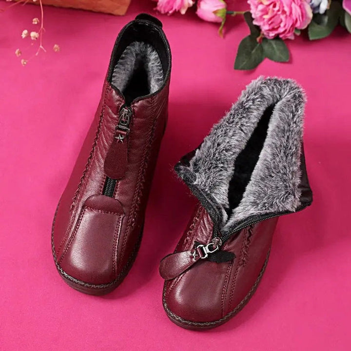 Burgundy fleece-lined leather ankle boots with front zip
