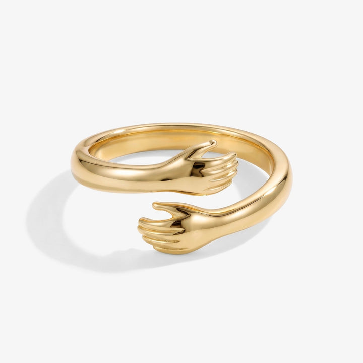 Gold hug ring with hugging hands