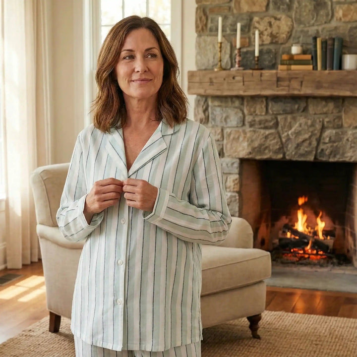 Striped cotton pyjama top in white with sage-green and blue stripes, worn, front view