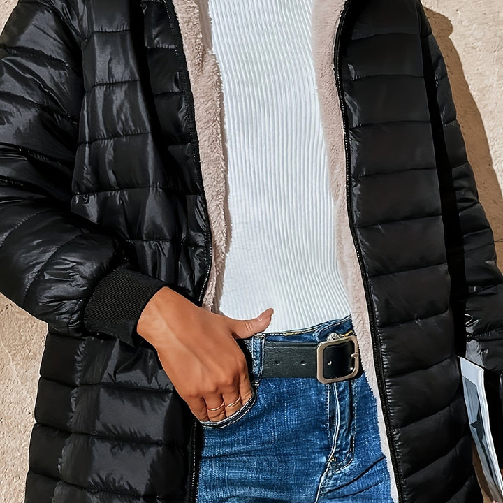 Woman in a long black puffer coat with teddy lining