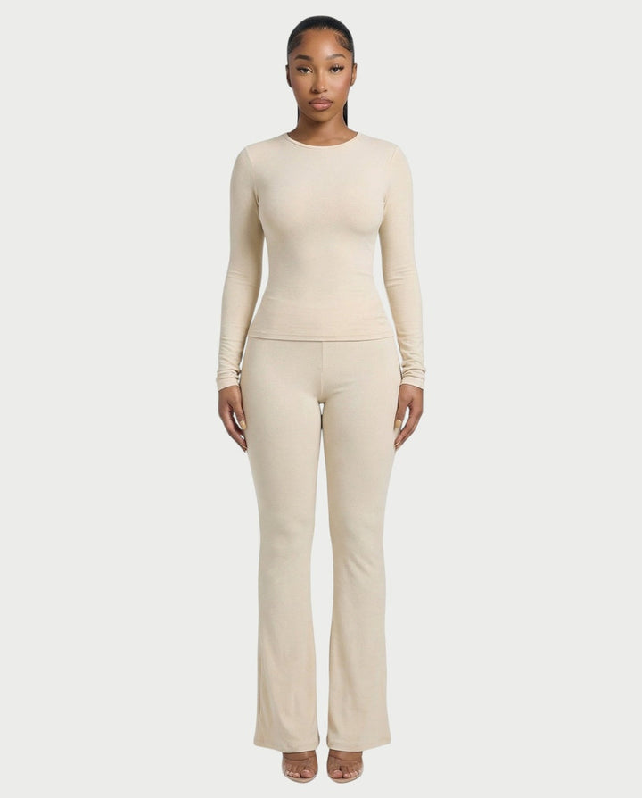 Off-white fitted long-sleeve top and high-waisted flared trousers, front view
