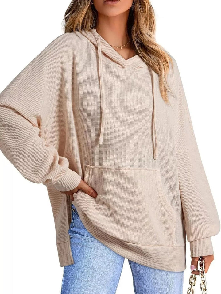 Woman wearing a beige oversized waffle hoodie with light jeans | Grace Aura