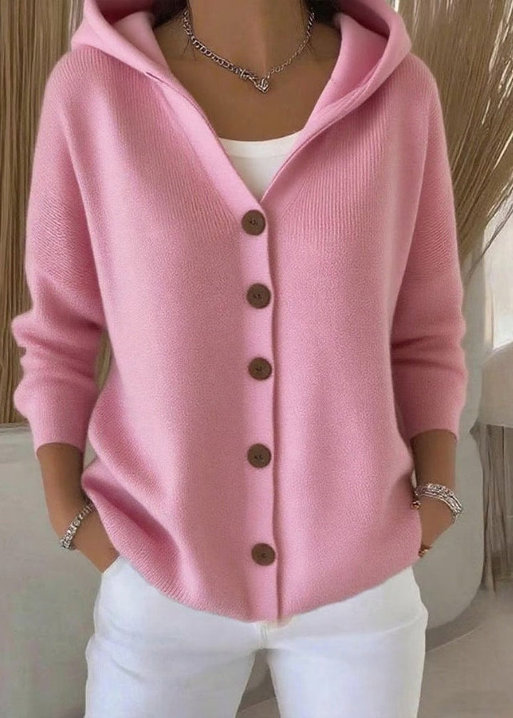 Pink button-front hooded cardigan worn by woman with white pants | Grace Aura