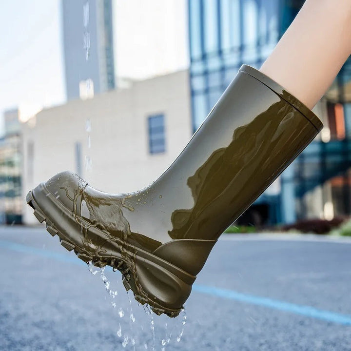 Platform mid-calf wellies in olive green, worn