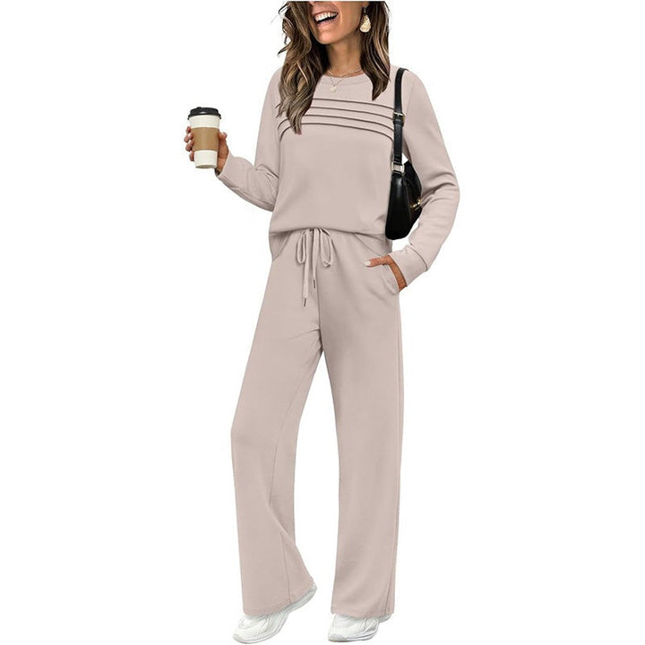 Woman wearing beige striped crew neck top with matching wide leg pants | Grace Aura