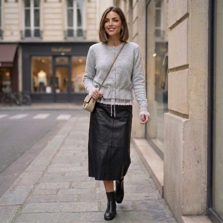 Knitted cardigan with lace trim and pearl buttons in grey, worn on the street