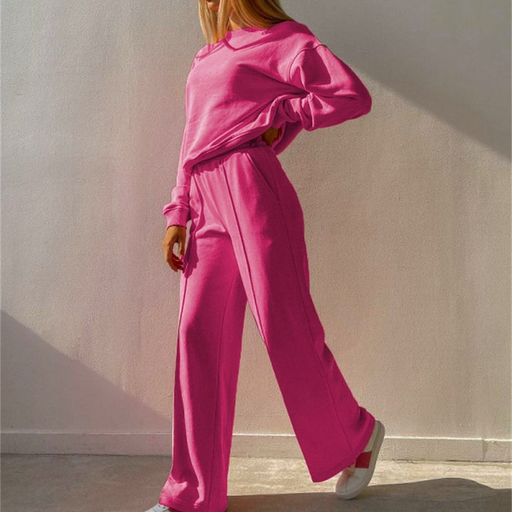 Hot pink tracksuit, full-length side view