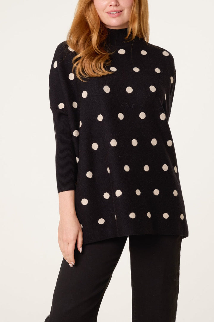 Polka dot batwing jumper in black/beige, front view