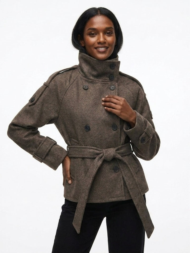 Short double-breasted trench coat with funnel neck in brown, worn, front view