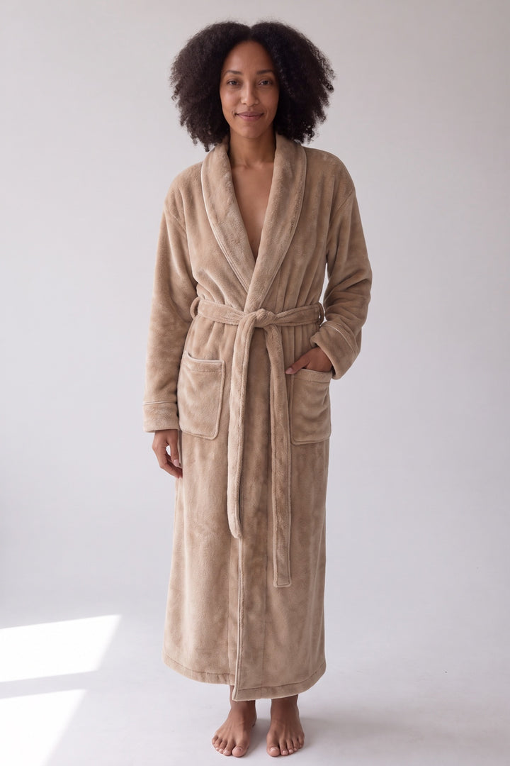 Beige long plush dressing gown with shawl collar and satin piping, worn, front view