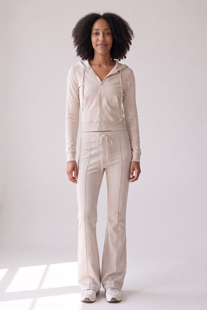 Oatmeal cropped zip hoodie and flared joggers, worn, front view