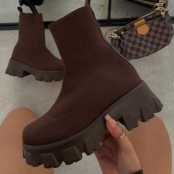 Brown knit chunky platform ankle boots worn on feet, checkered bag visible | Grace Aura