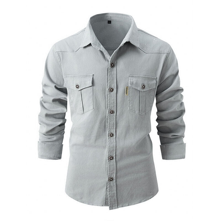 Light gray denim button-up shirt with chest pockets, worn by model | Grace Aura
