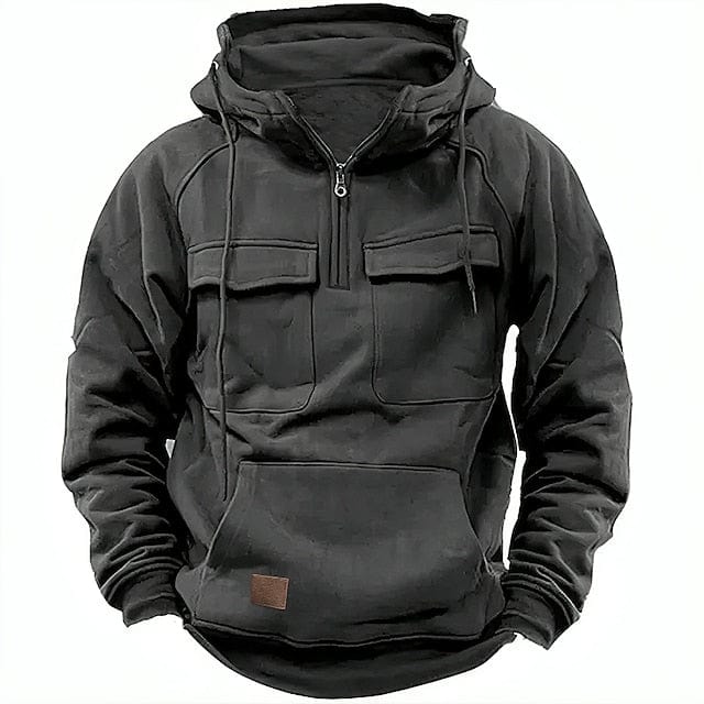 Black quarter-zip cargo hoodie with chest pockets, worn by a person | Grace Aura