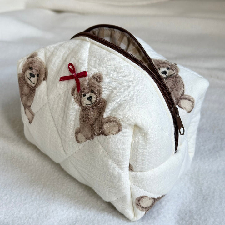 White quilted cotton pouch bag with teddy bear print and brown zipper | Grace Aura
