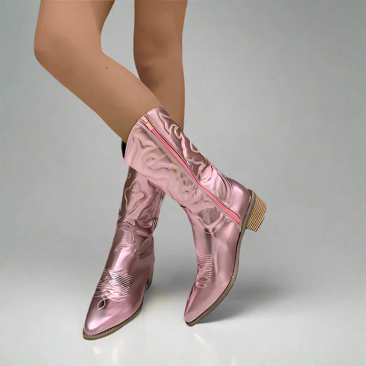 Metallic pink western boots with embroidered pattern worn by woman, pointed toe block heel | Grace Aura