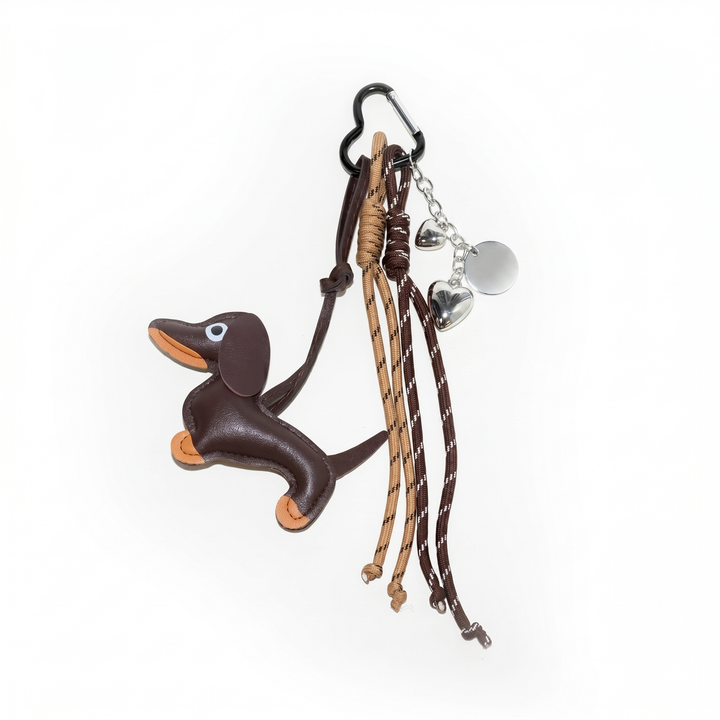 Brown leather dachshund bag charm with braided cord tassels and heart charms | Grace Aura