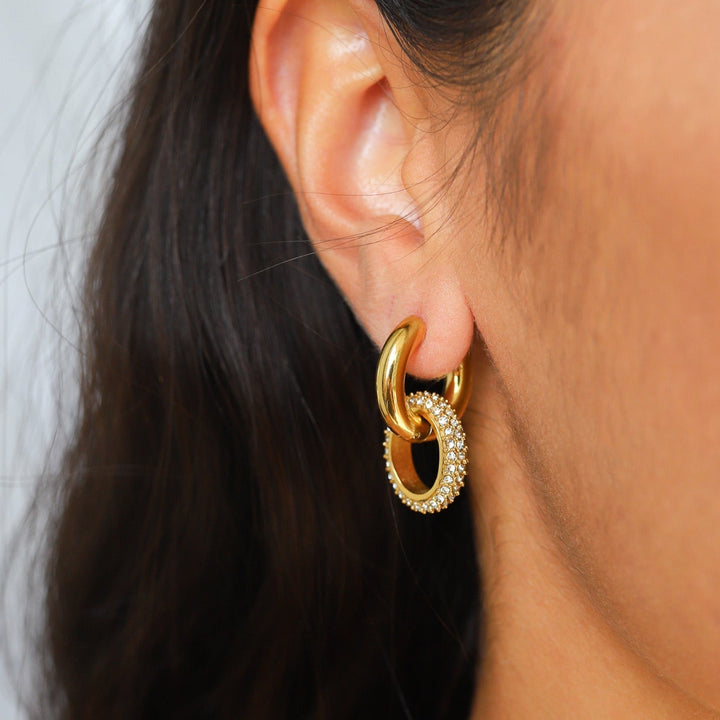 Gold double hoop earrings with pavé crystal ring, worn by model | Grace Aura