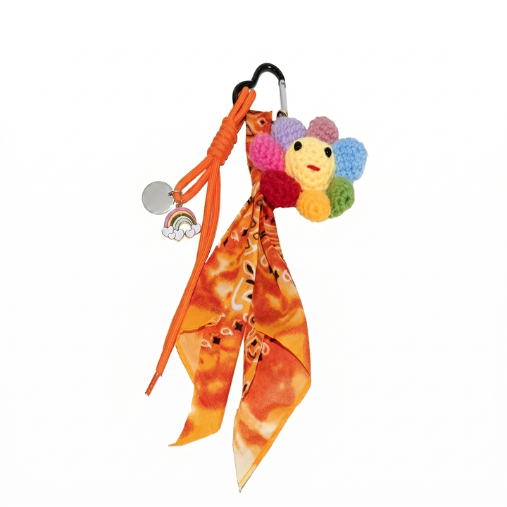 Crochet flower keychain with orange tie-dye bandana on carabiner clip | Grace Aura