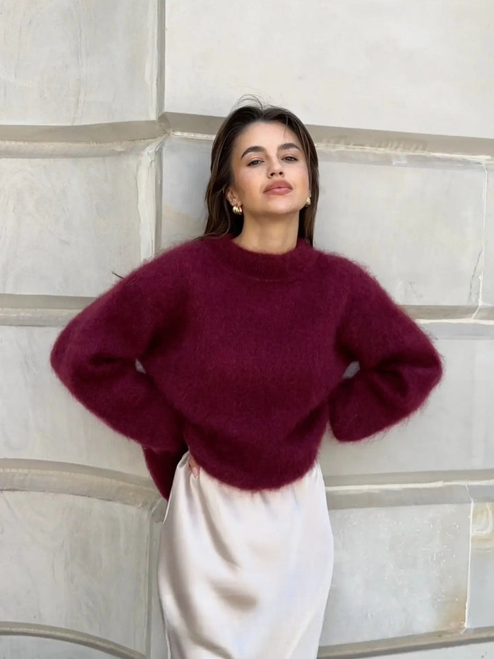 Woman wearing burgundy fluffy oversized knit sweater with cream satin skirt | Grace Aura
