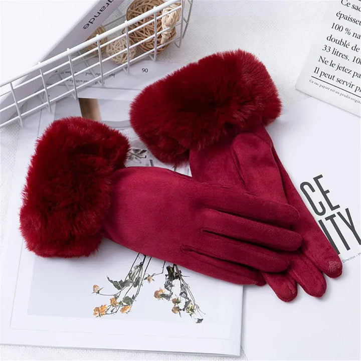 Red suede gloves with faux fur cuffs displayed flat on book | Grace Aura