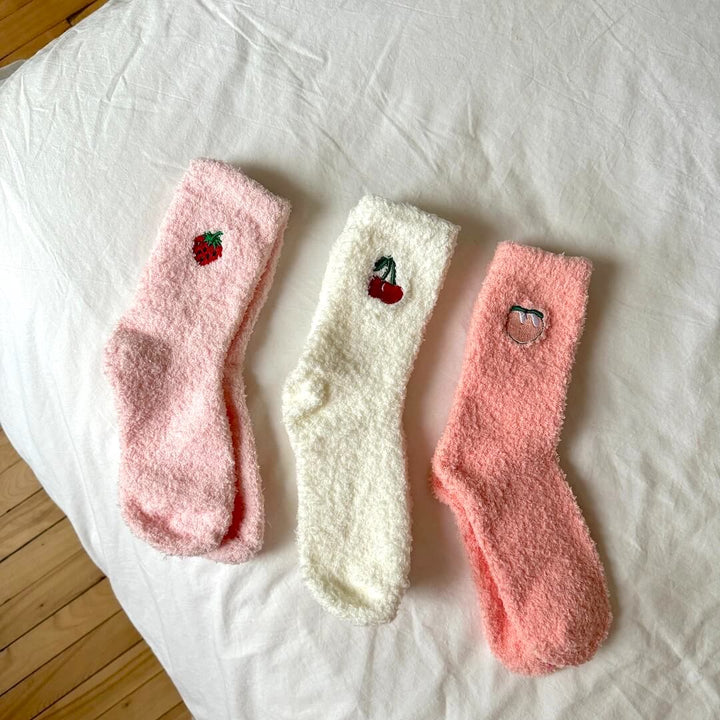 Three fuzzy socks laid flat, pink and cream with fruit embroidery | Grace Aura