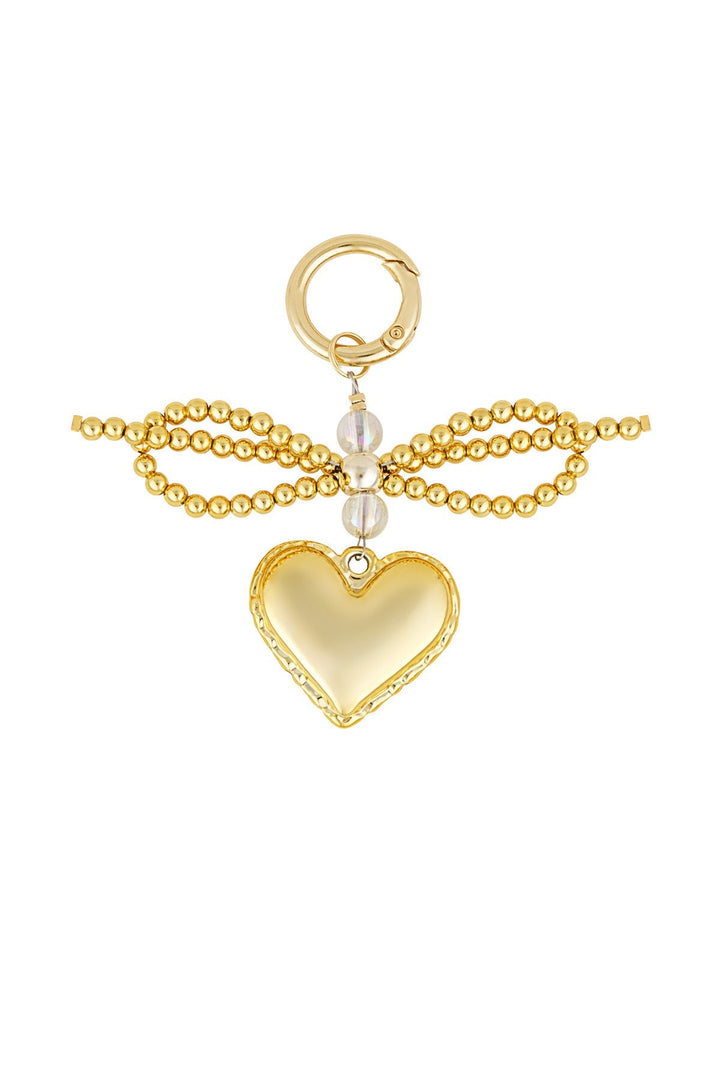 Gold beaded charm with pearl accents and a heart pendant, flat lay | Grace Aura