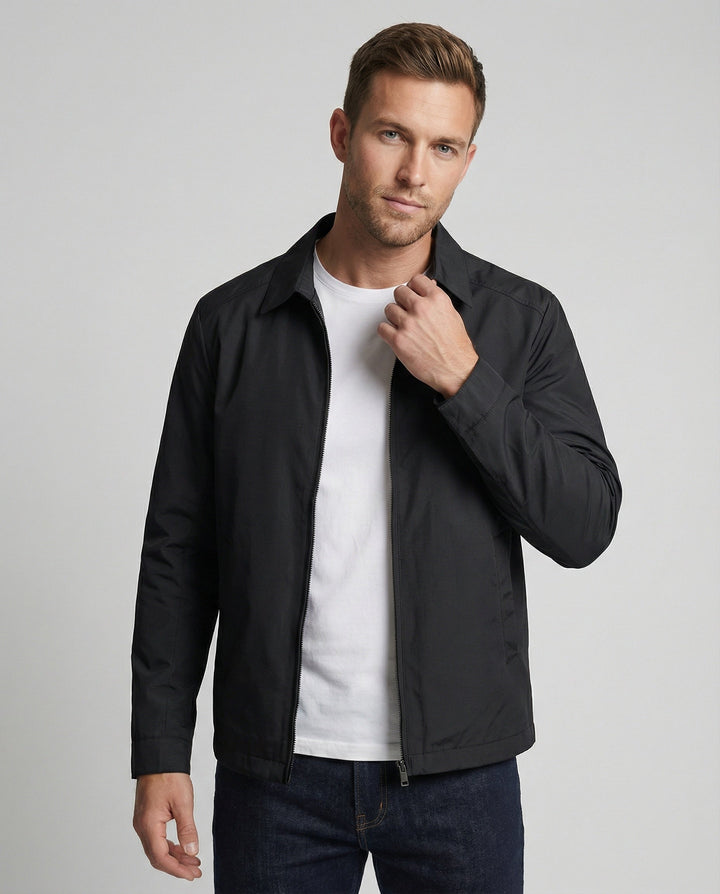 Man wearing black lightweight zip-up Harrington jacket with white t-shirt underneath | Grace Aura