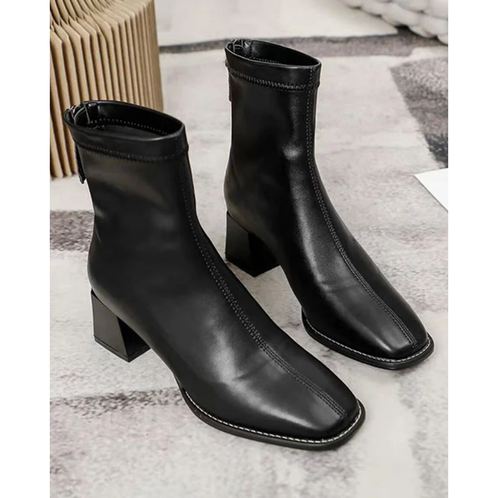 Black leather ankle boots with square toe and block heel, displayed flat | Grace Aura