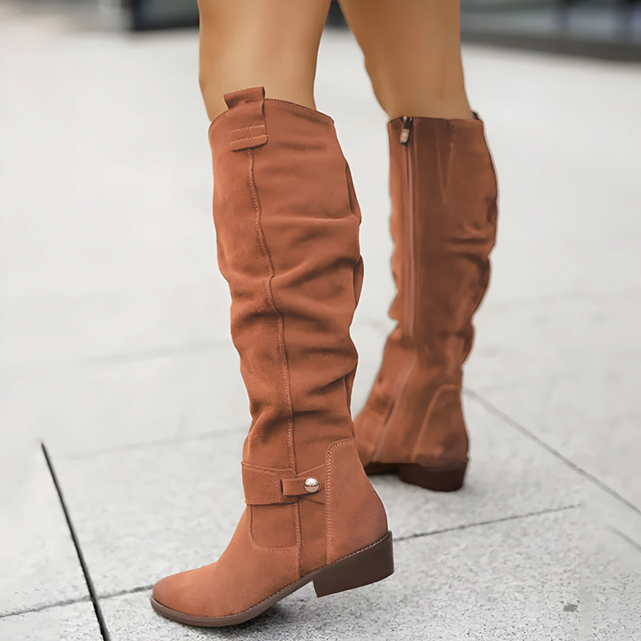 Rust brown suede knee-high boots with low heel, worn by model | Grace Aura