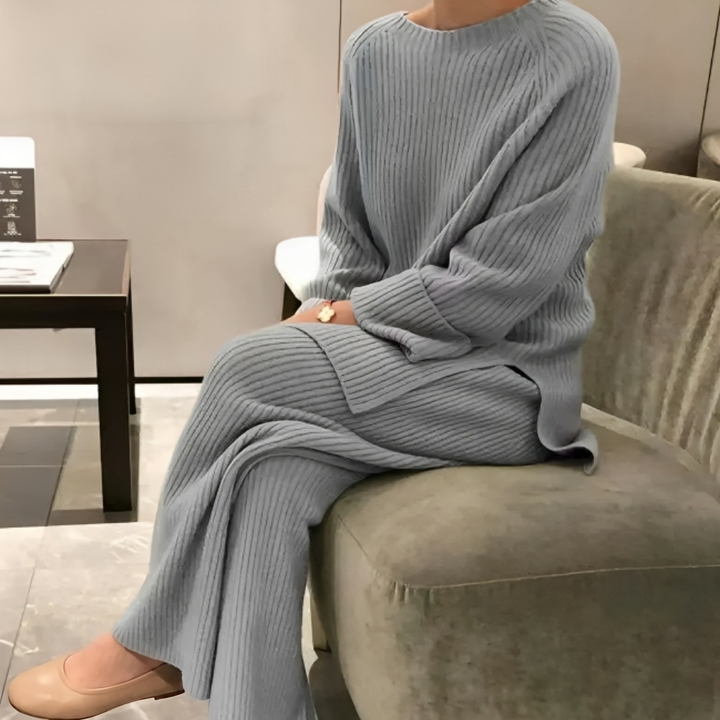Gray ribbed knit lounge set worn by woman sitting on sofa | Grace Aura