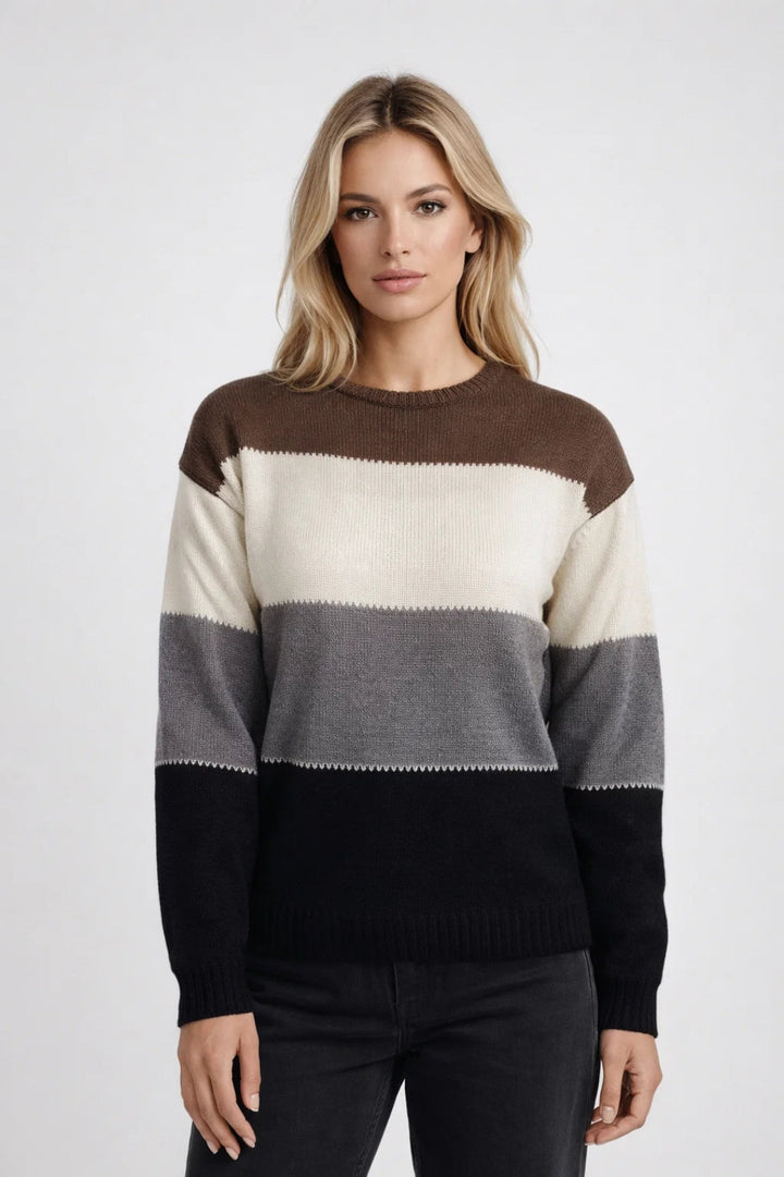 Woman wearing brown, cream, gray, and black color-block knit sweater | Grace Aura