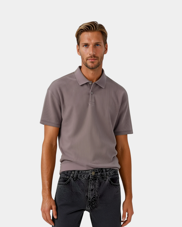 Man wearing grey collared polo shirt with dark jeans, worn look | Grace Aura